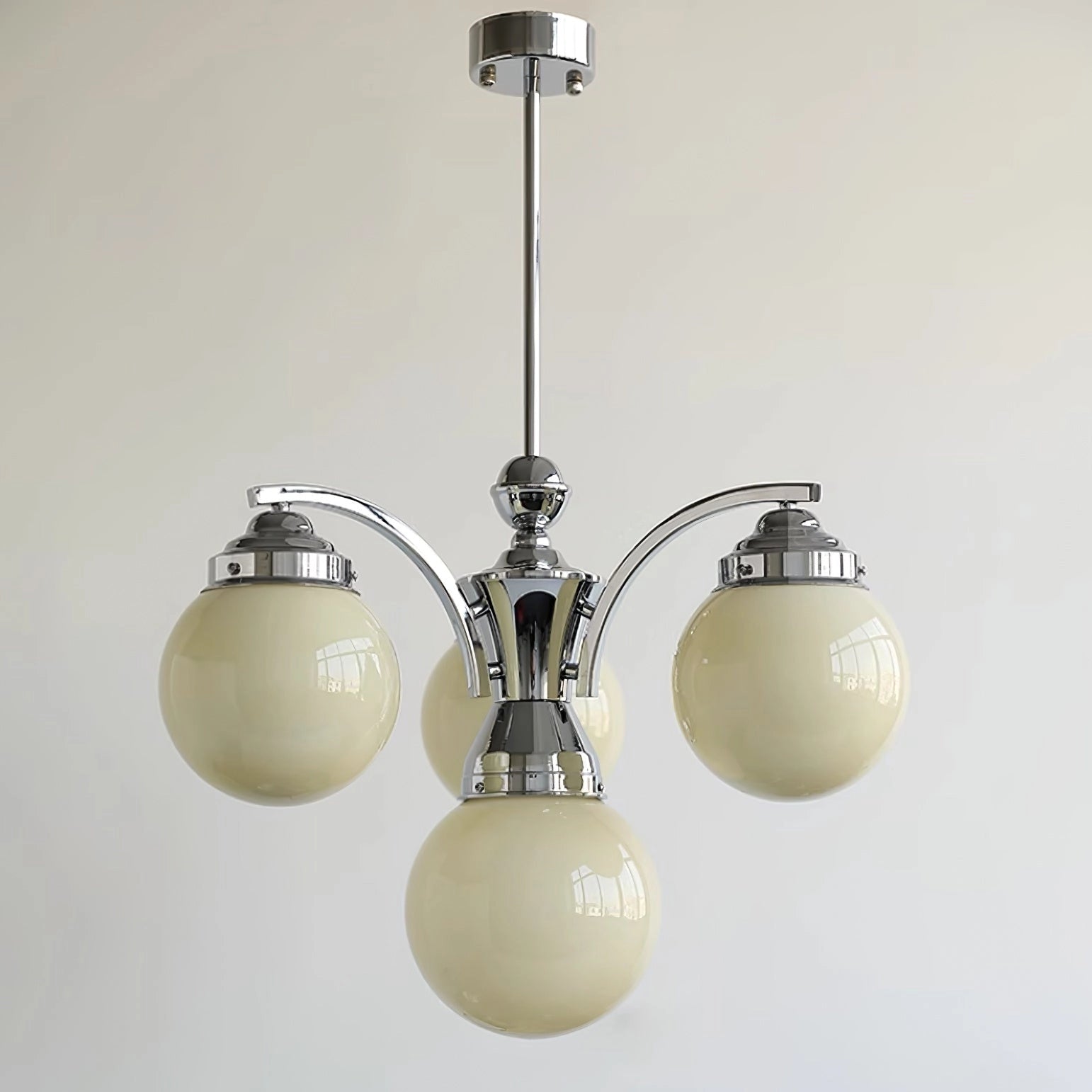 Modern pink glass chandelier with circular design, featuring a minimalist and elegant aesthetic, installed on the ceiling with metal fixtures and light bulbs.