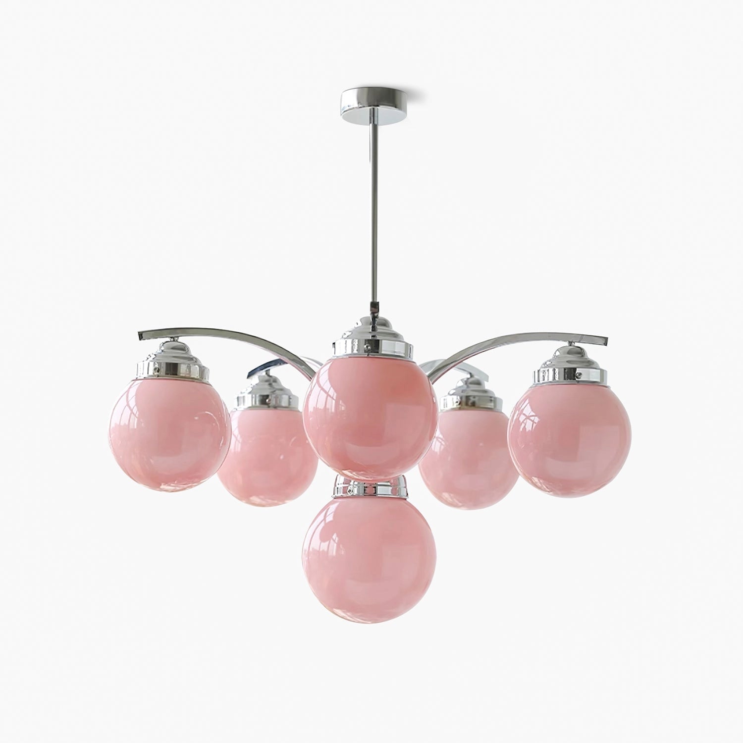 Modern pink glass chandelier with minimalist design, hanging from the ceiling, featuring elegant circular shapes and a magenta hue.