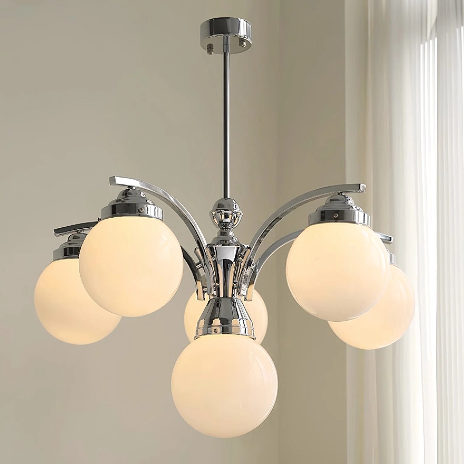 Modern pink glass chandelier with elegant minimalist design, featuring a metal ceiling fixture and symmetrical shade.