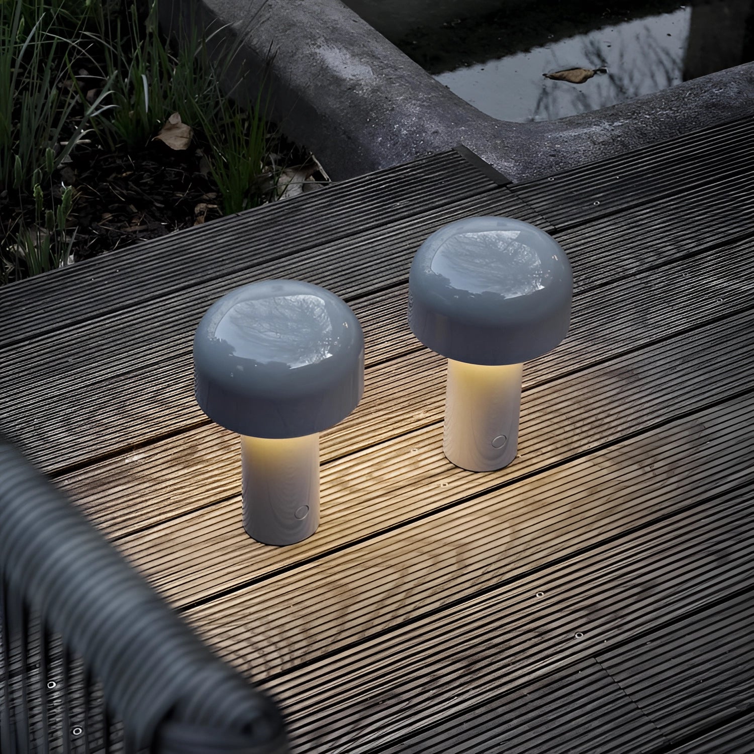 Modern portable wireless LED lamp with a sleek design and touch control, placed on a wooden table surface.