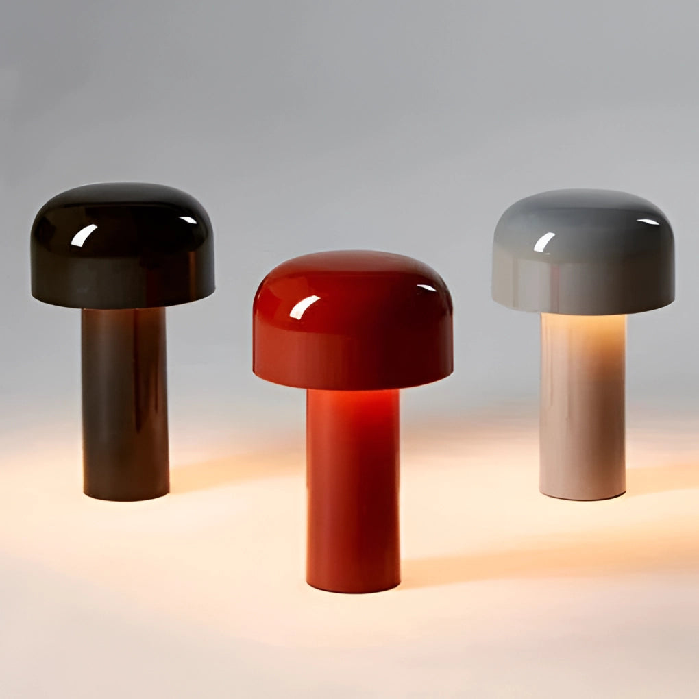 Modern portable wireless LED lamp with a sleek cylindrical design, featuring touch control interface. The lamp has a combination of metal and plastic elements, and is set against a wooden background with a hint of magenta lighting.