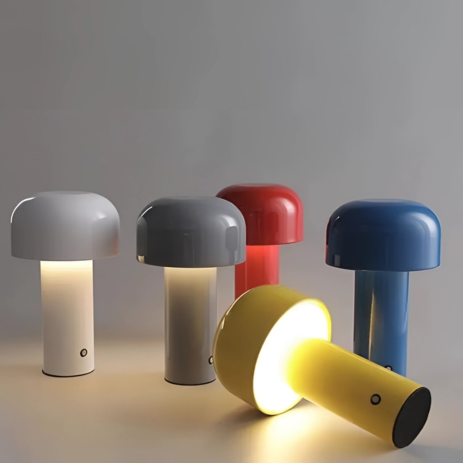 A modern portable wireless LED lamp with a sleek design and touch control, featuring a cylindrical shape, placed on a table.