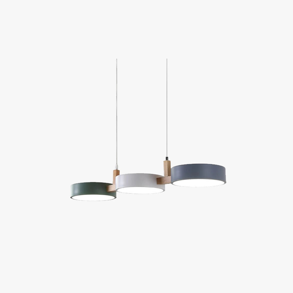 Modern Scandinavian adjustable triple pendant lights with metal and rectangular design, hanging from the ceiling, illuminating a dining room.