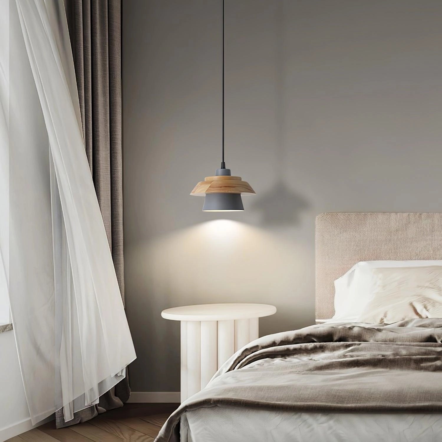Modern Scandinavian black pendant lamp with a wood accent, hanging in a contemporary kitchen interior.