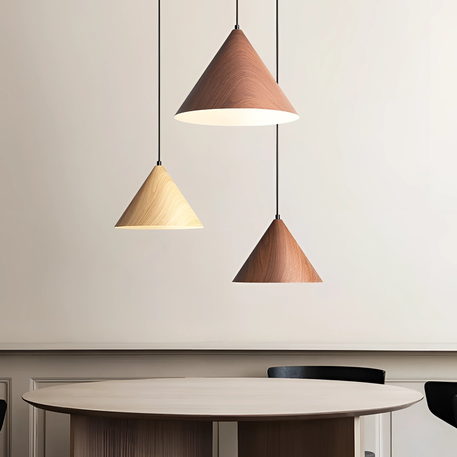 Modern Scandinavian eco-friendly triangle wooden pendant light with a white shade, hanging over a wooden table in a minimalist interior design setting.