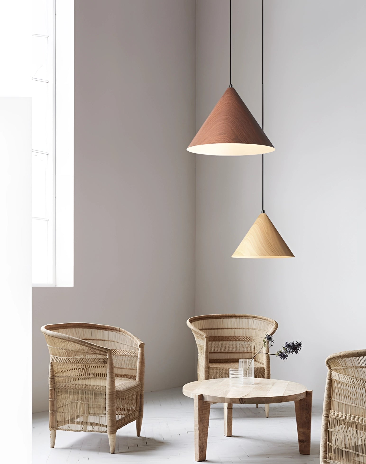 Modern Scandinavian eco-friendly triangle wooden pendant light hanging in a minimalist interior, showcasing its geometric design and natural wood material that complements the contemporary decor.