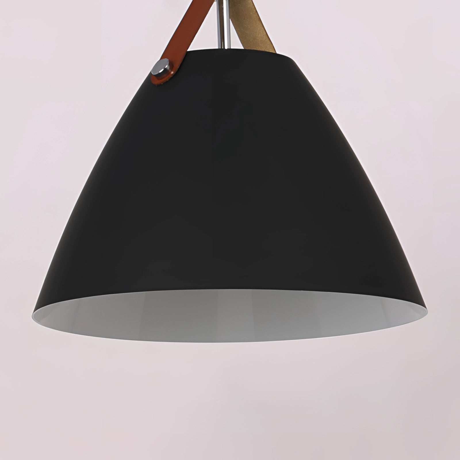 Modern Scandinavian pendant lights with black and white adjustable cone-shaped shades, hanging from the ceiling as a stylish and contemporary lighting fixture.