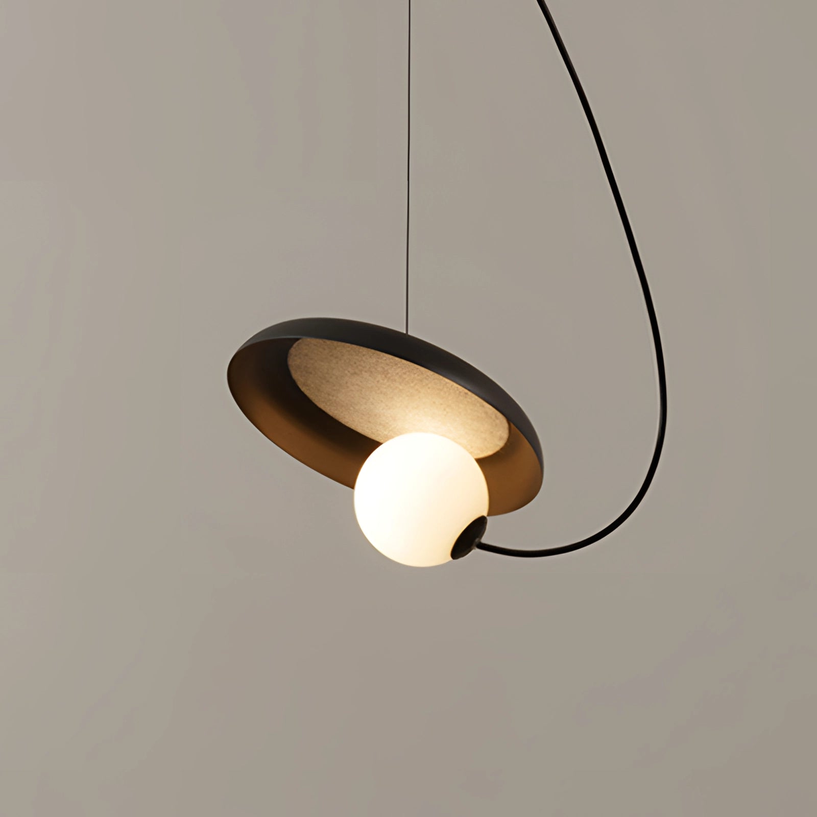 Modern Scandinavian pendant light with a minimalist design featuring a wooden accent, circular lampshade, and ceiling fixture, providing an elegant and artistic touch to the room.