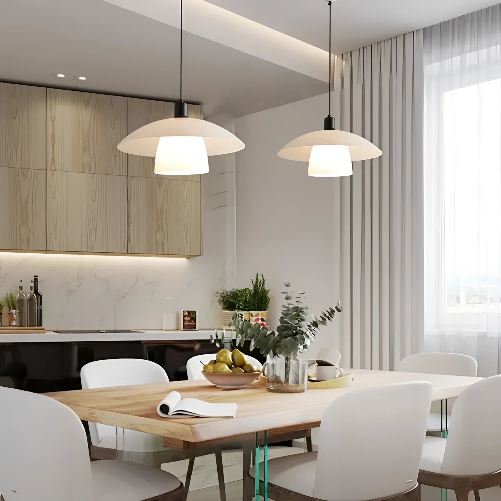Modern Scandinavian white dome pendant lights hanging over a kitchen island with wooden furniture and plants in the background.