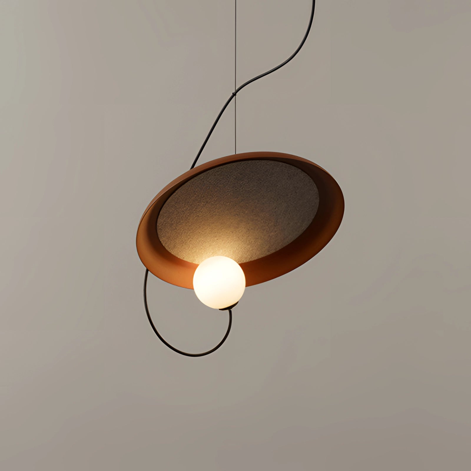 Modern Scandinavian pendant light with minimalist wood accents, featuring an amber glow and circular design suitable for contemporary interiors.