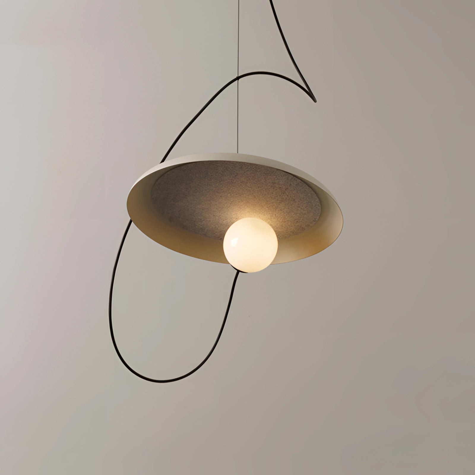 Modern Scandinavian pendant light with a minimalist wood accent, featuring a beige circular lampshade, suspended from the ceiling as an elegant lighting fixture.