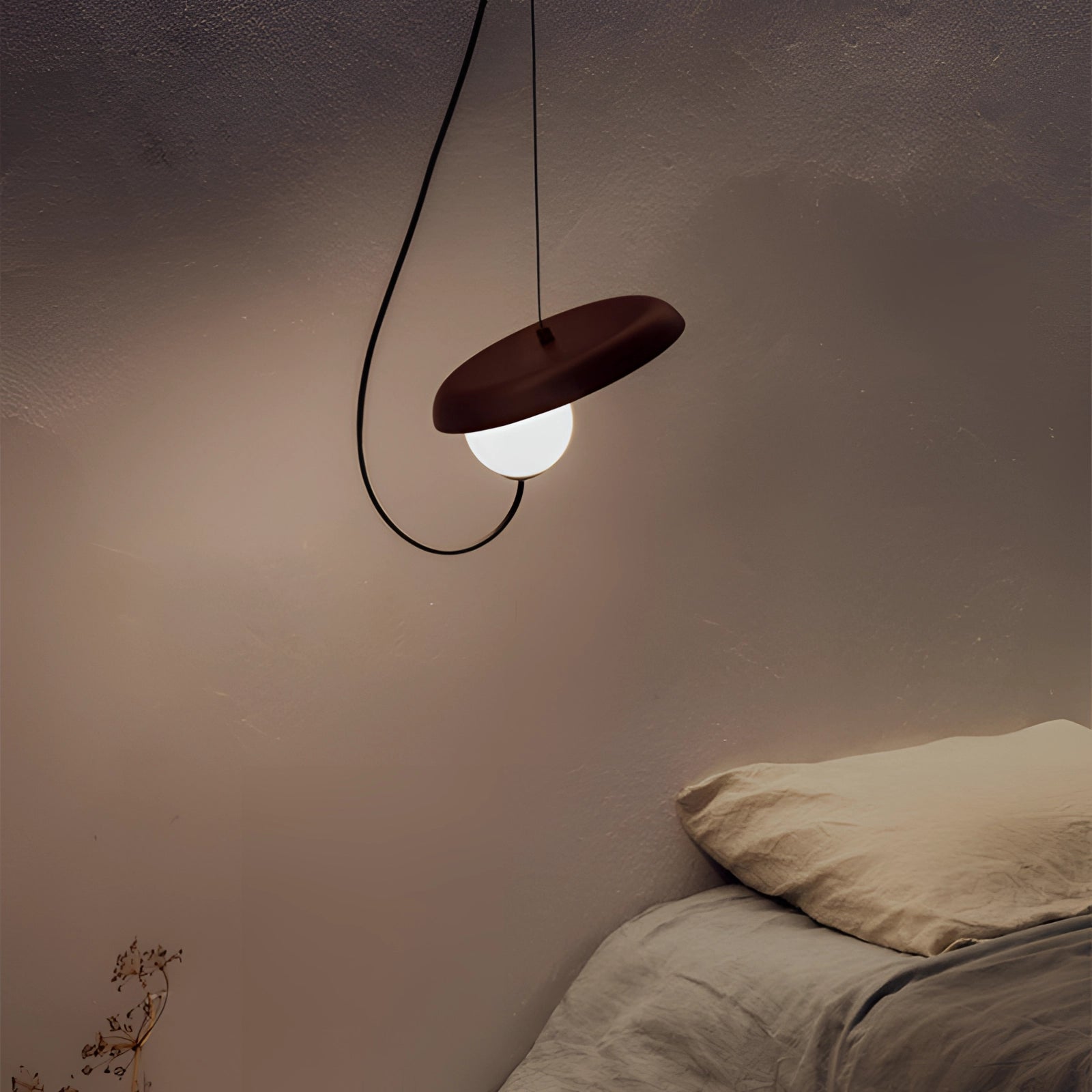 Modern Scandinavian pendant light with a minimalist design, featuring a black 9.8-inch shade and wood accent, hanging from the ceiling.