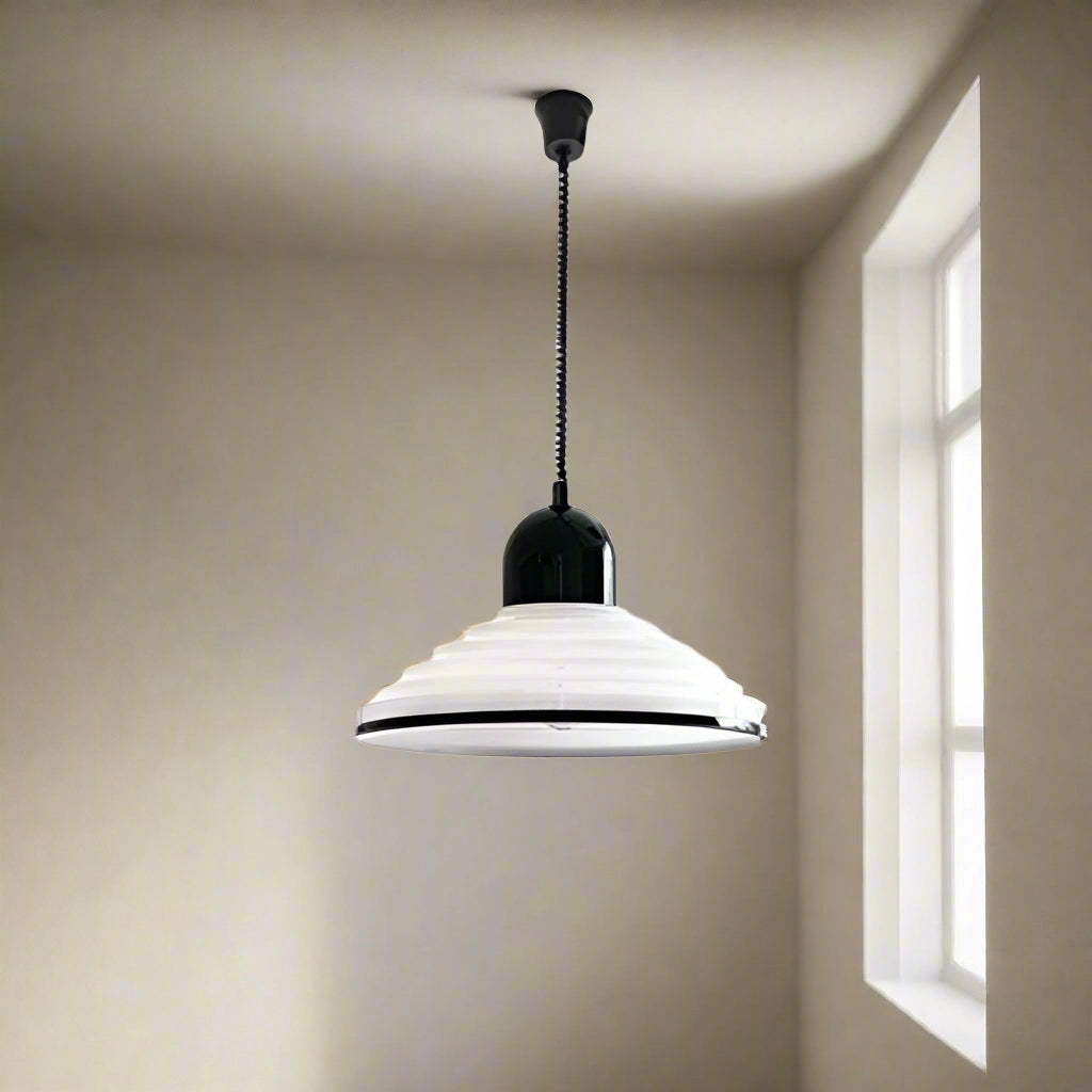 Modern Scandinavian white acrylic pendant light with a minimalistic design, featuring a sleek shade suspended from the ceiling, blending elements of wood and metal for a contemporary decor fixture.