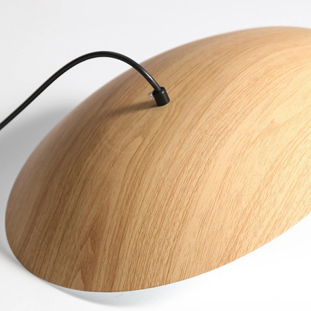 Modern Scandinavian Wooden & Metal Pendant Light hanging above a dining room table, featuring a sleek design with a combination of wood and metal elements, creating an elegant and contemporary ambiance.