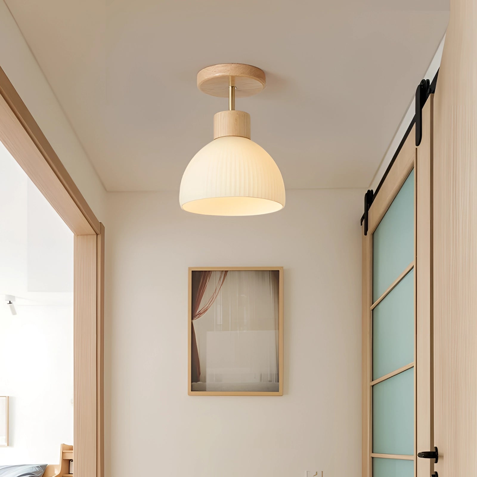 Modern Scandinavian wooden pendant light with a ribbed glass shade, featuring a natural wood finish and designed to hang from the ceiling, enhancing the ambiance of a room with its contemporary aesthetic.