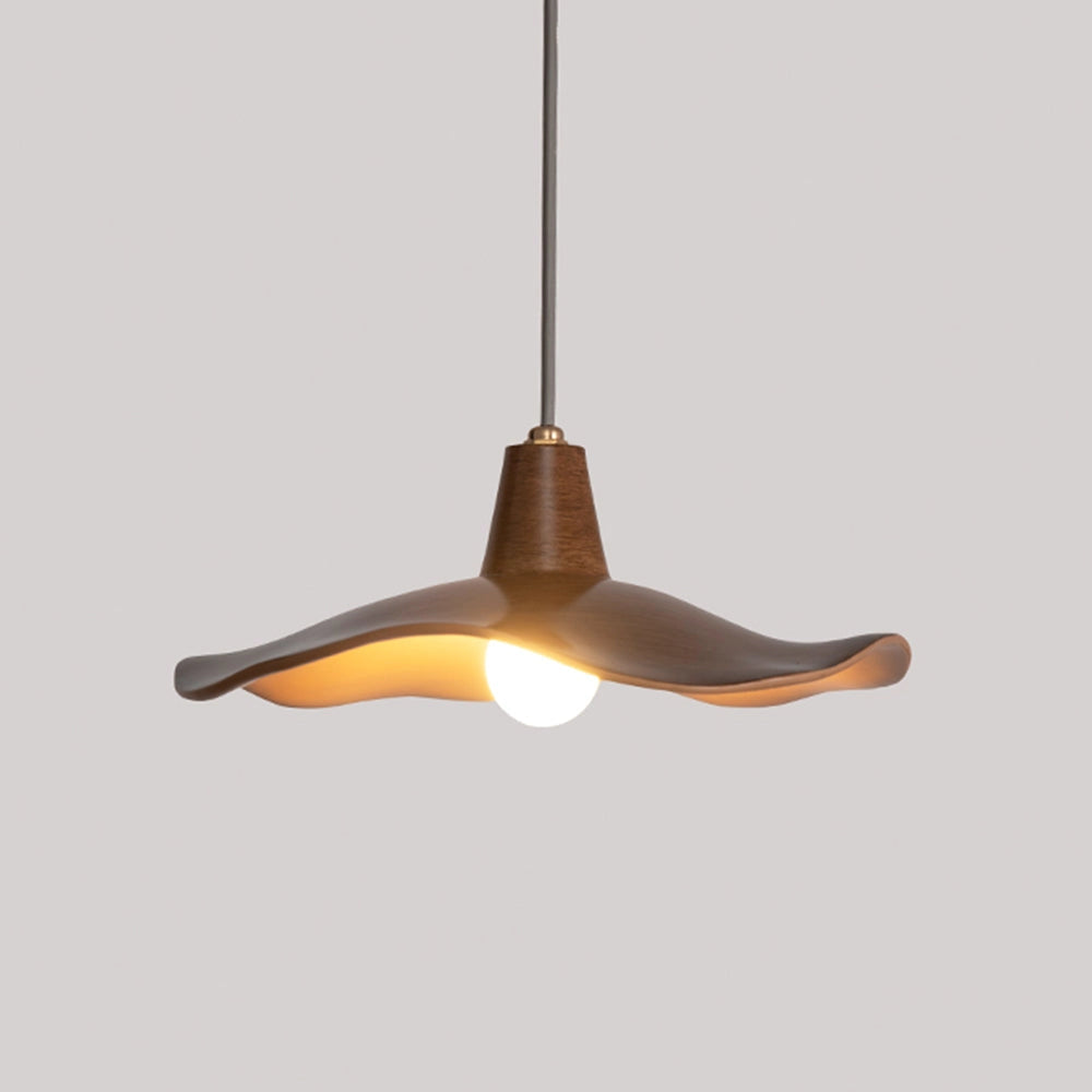 Modern sculptural wood pendant light with an organic design, featuring a unique handcrafted structure, hanging from the ceiling as a light fixture.