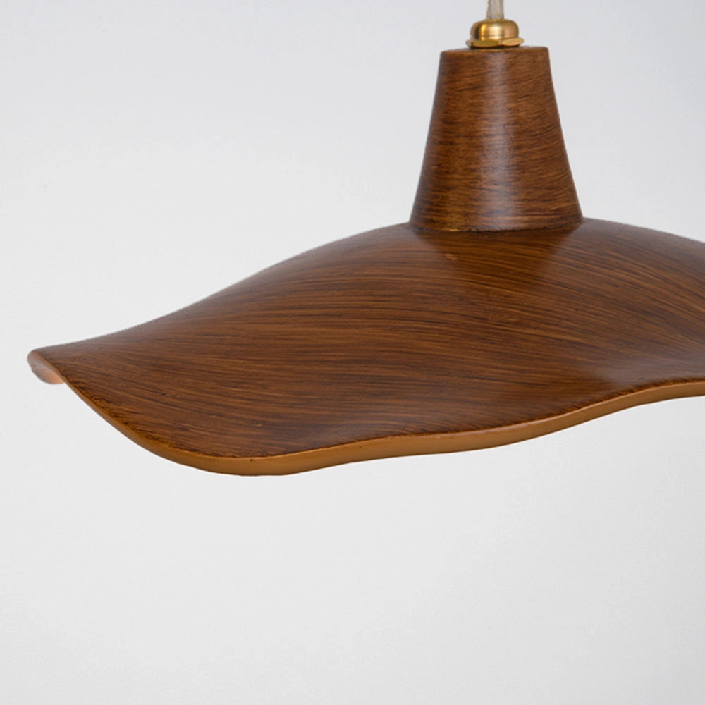 Handcrafted sculptural wood pendant light with an organic design, showcasing a natural wood finish and artistic craftsmanship.