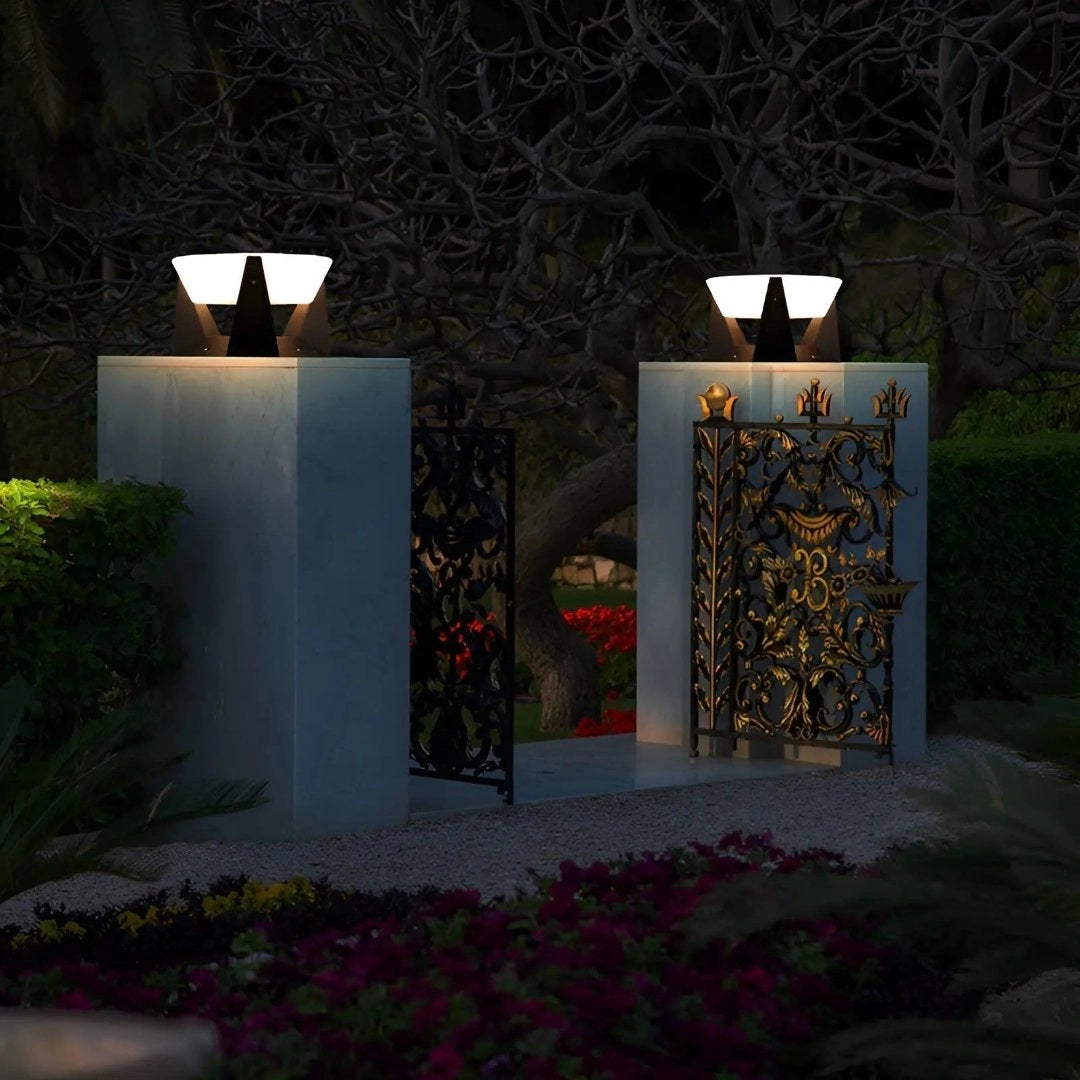 Modern SolarLux outdoor torch lights illuminating a stylish garden setting, surrounded by lush green plants and vibrant flowers, with architectural elements subtly visible in the background.