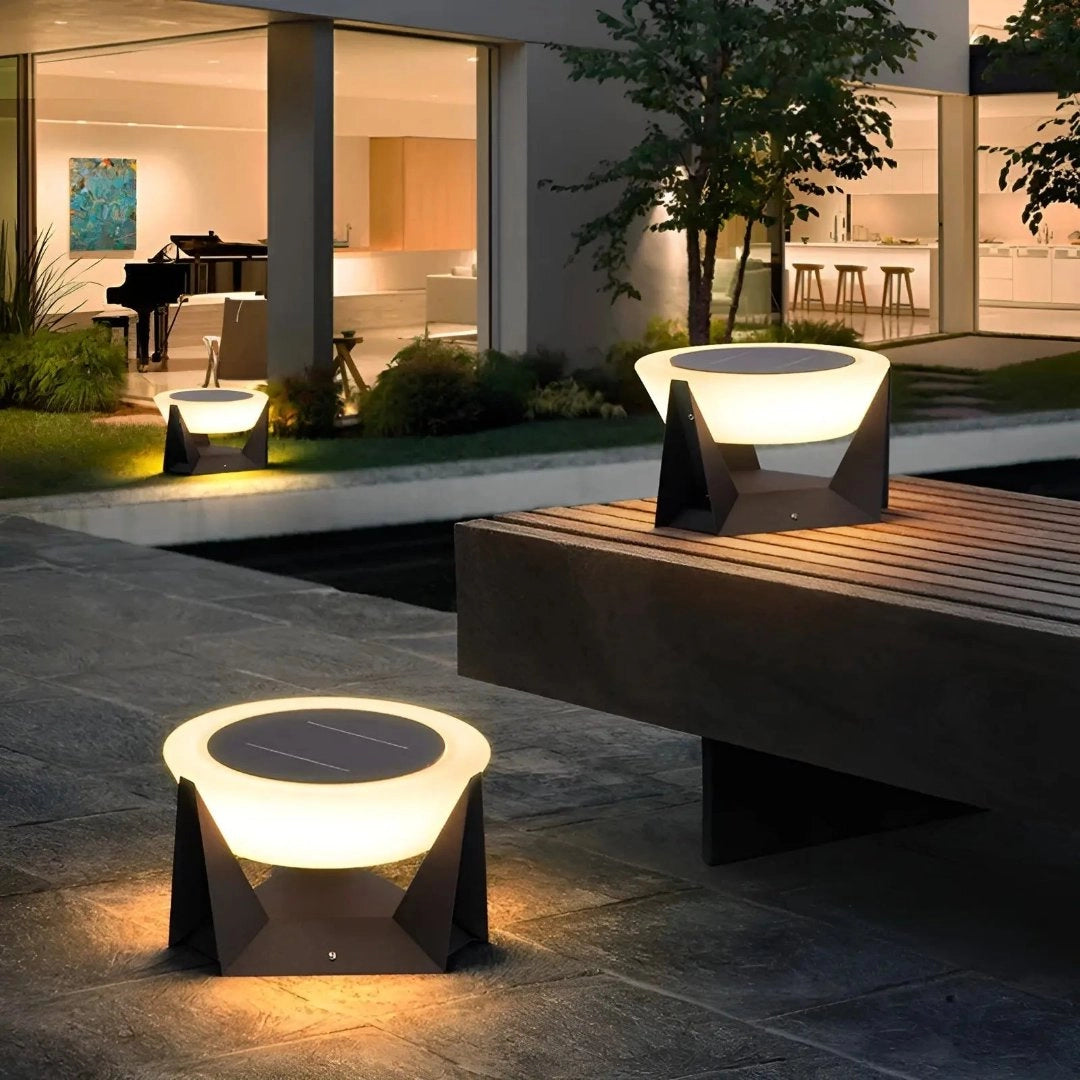 Modern SolarLux outdoor lighting featuring stylish torch design illuminating a garden setting, with wooden accents and a sleek, rectangular structure seamlessly blending with surrounding plants and architecture.