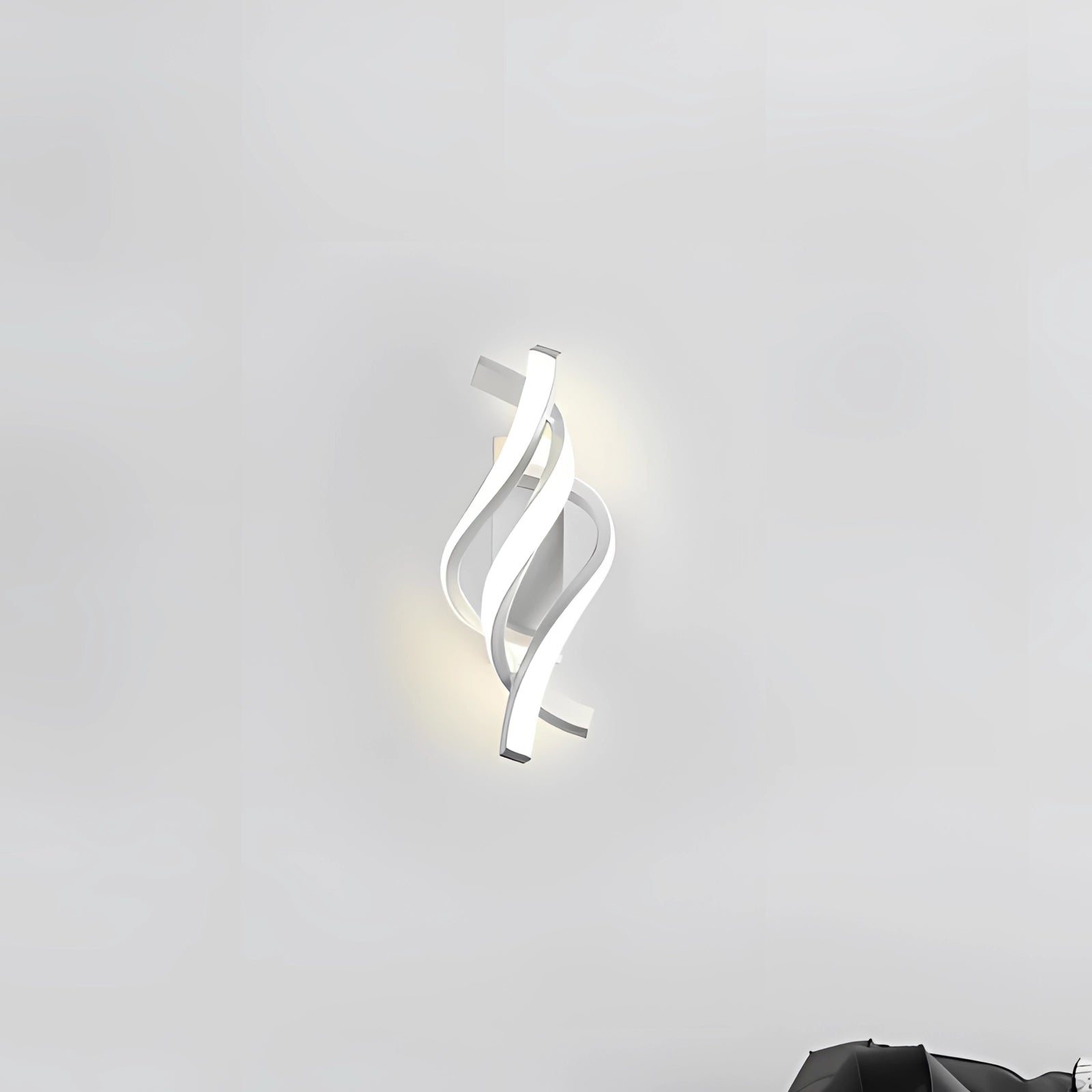 White modern spiral LED wall sconce with a minimalist design, featuring a sleek, energy-efficient light structure.