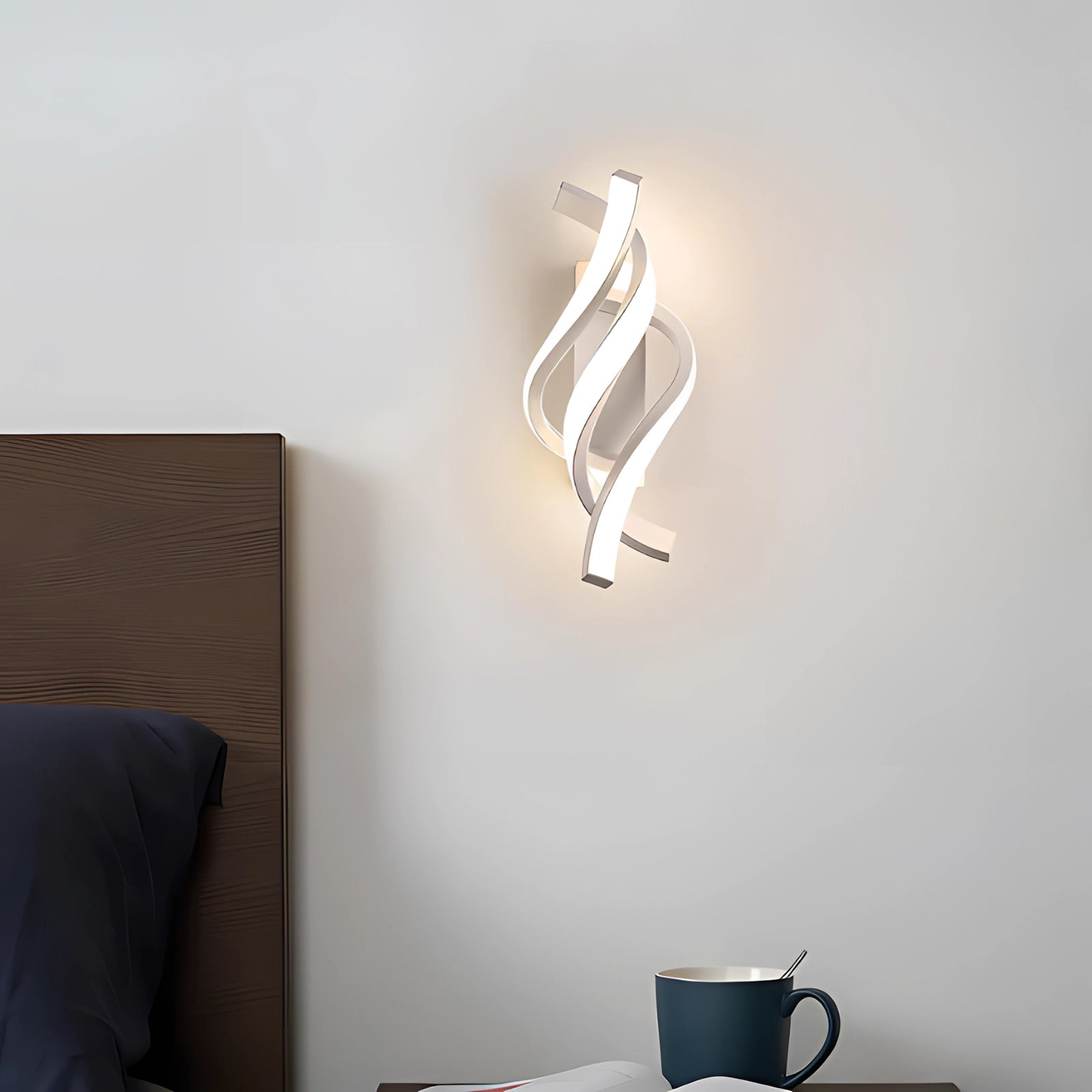 Modern spiral LED wall sconce with a minimalist design, featuring a sleek metal and wood construction, elegantly mounted on a rectangular base, providing energy-efficient lighting.