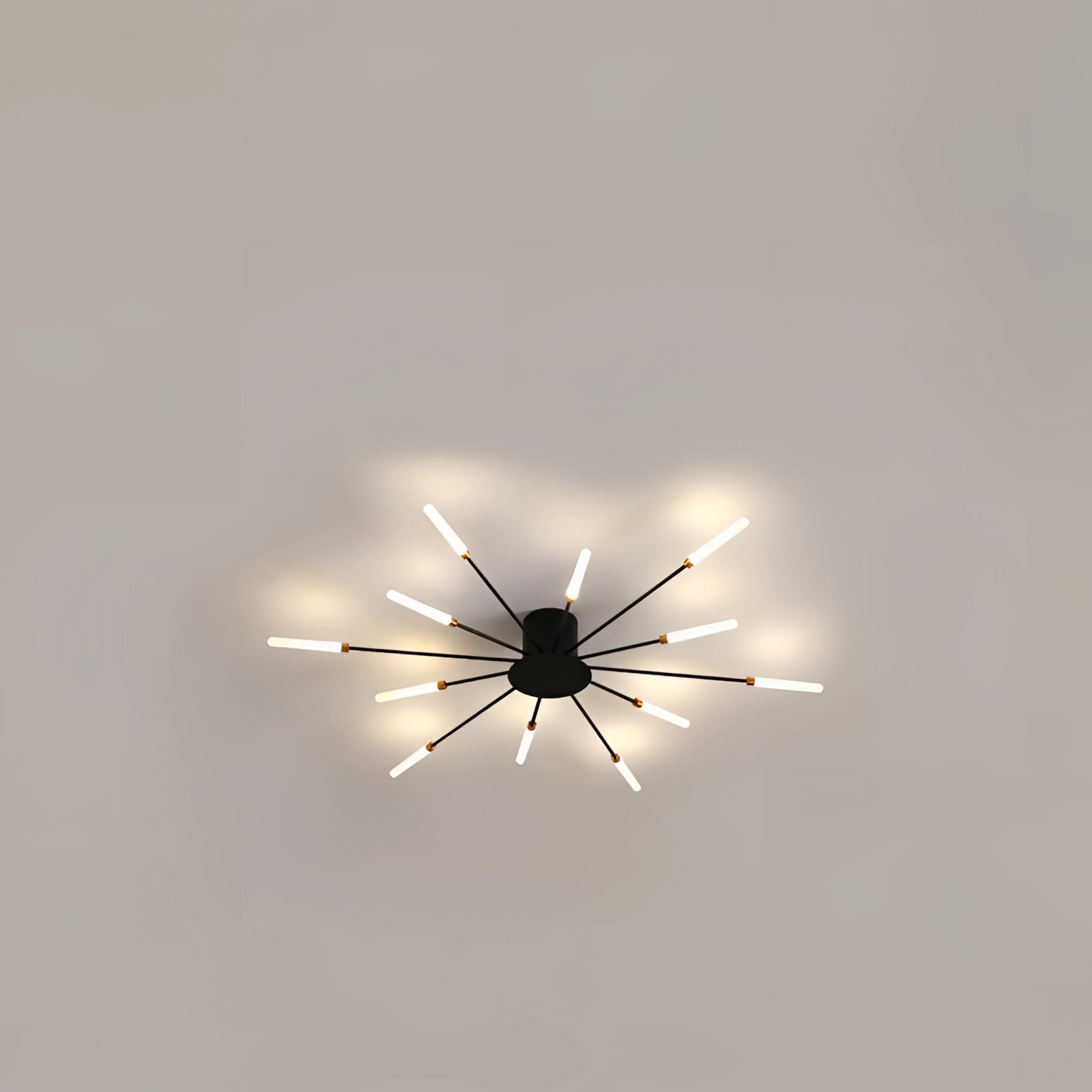 Modern Starburst LED Chandelier in black with 12 lights, featuring a luxurious black and white design, installed on a ceiling.
