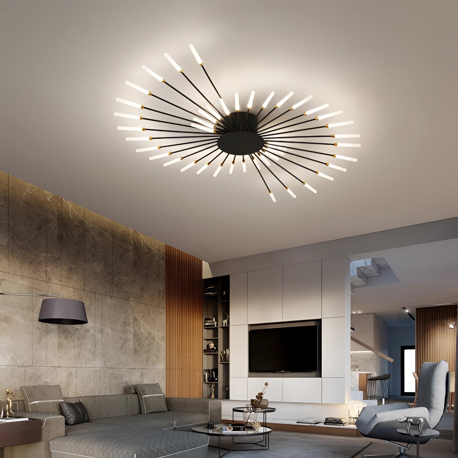 Modern Starburst LED Chandelier in black and white, elegantly hanging from the ceiling, illuminating a stylish living room with contemporary furniture, including a comfortable couch and a wooden table.