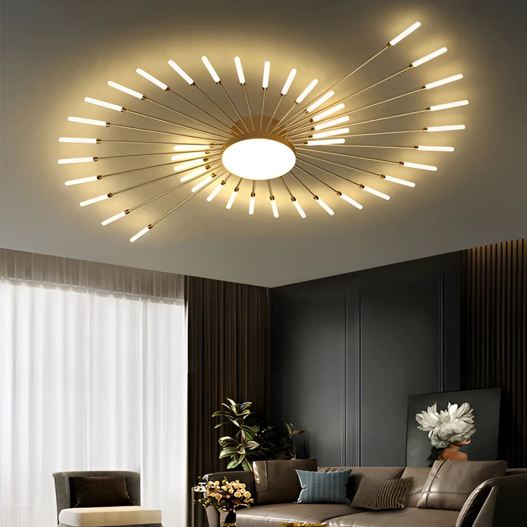 Modern starburst LED chandelier with a gold finish, hanging in a stylishly decorated living room featuring contemporary furniture and a houseplant, highlighting the interior design and lighting.
