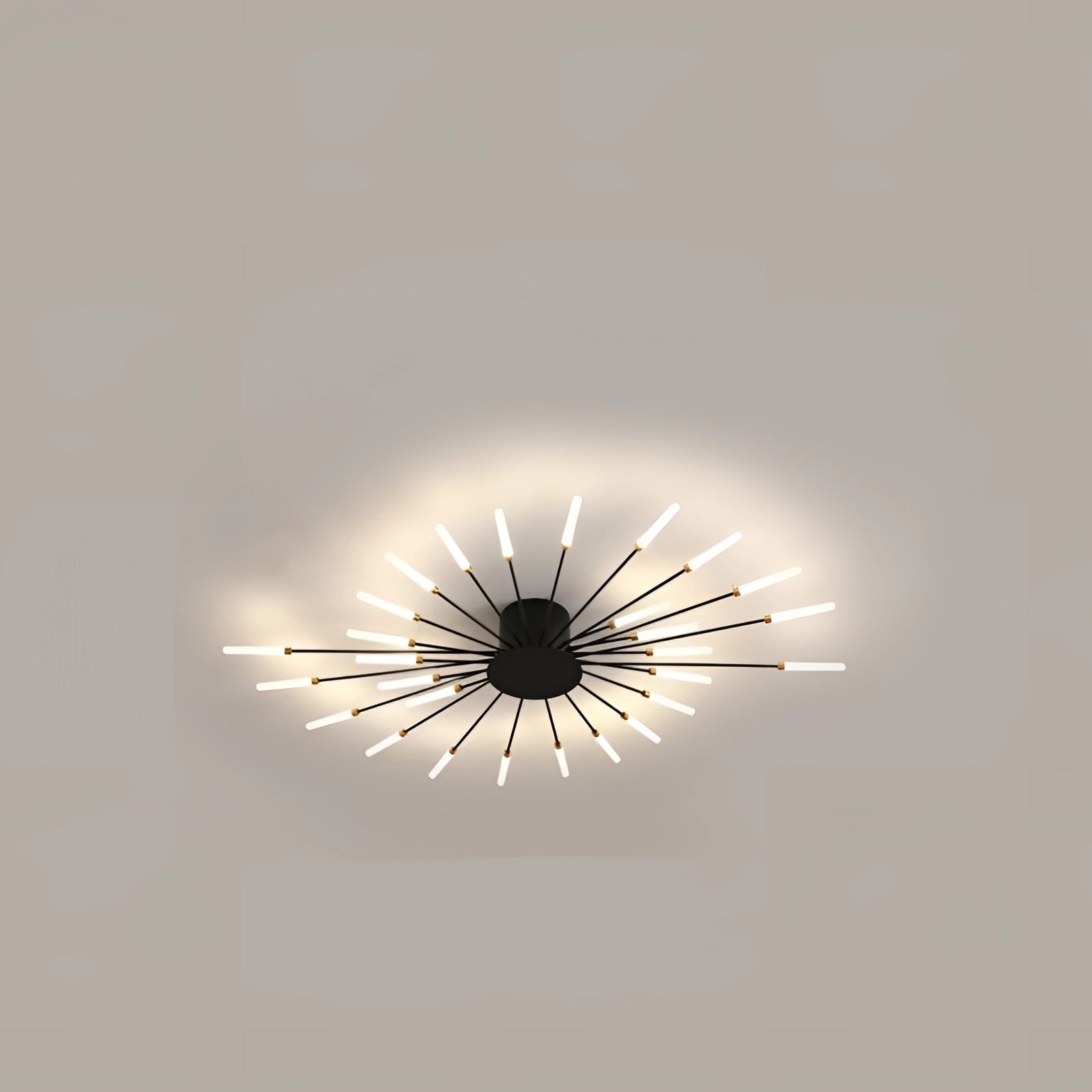 Modern black and white starburst LED chandelier with symmetrical design, mounted on a ceiling.