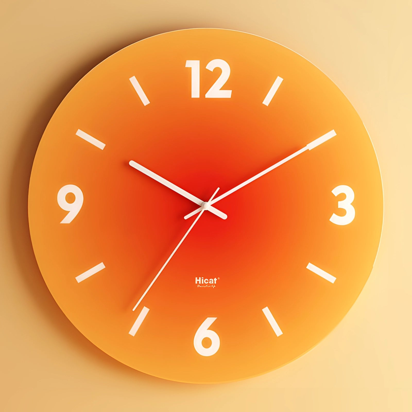 Modern sunset orange wall clock with a minimalist gradient design, featuring a circular shape and bold numbers in an analog display.