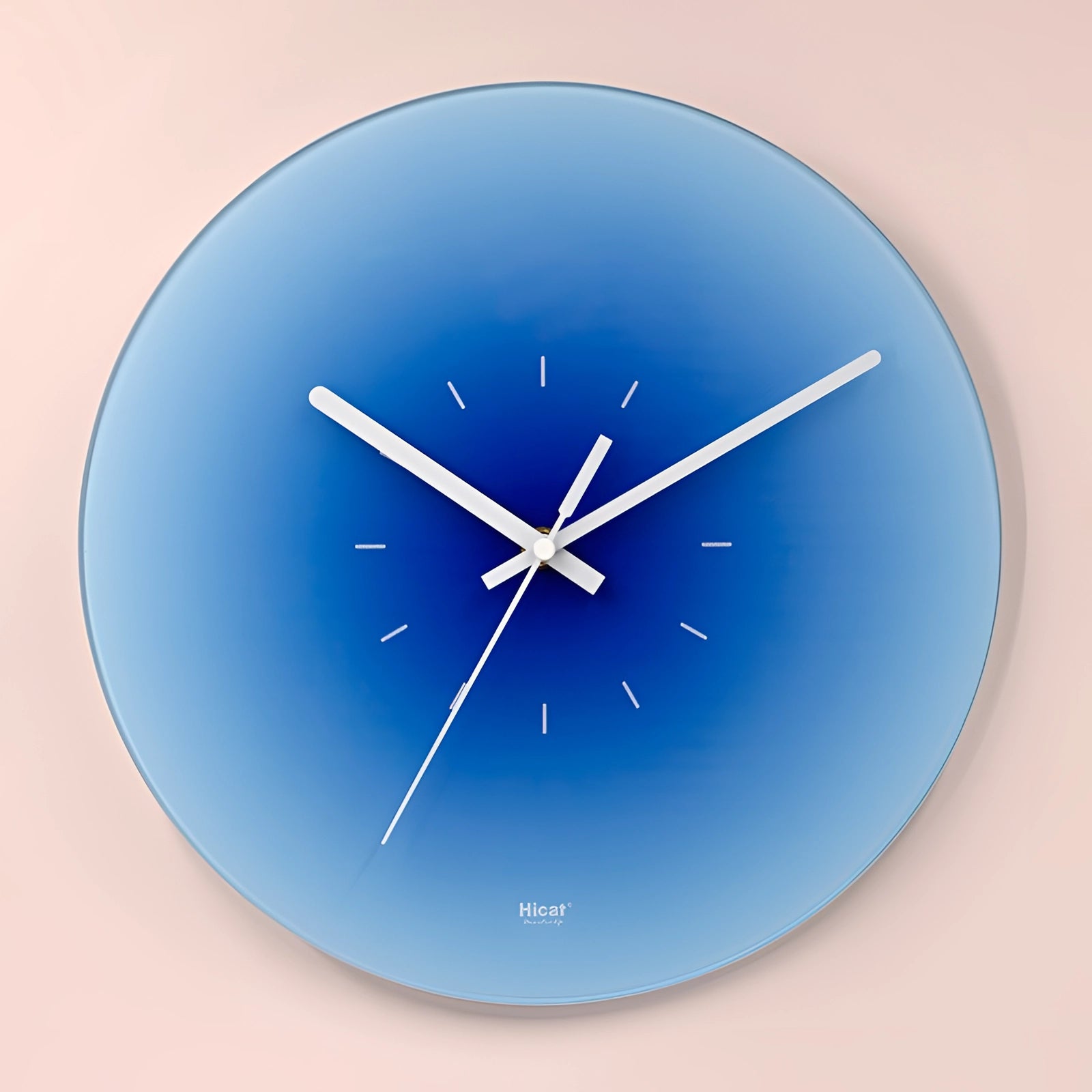 Modern sunset orange wall clock featuring a minimalist gradient design with a dominant electric blue color, showcasing a circular shape with simplistic font and symmetrical layout.