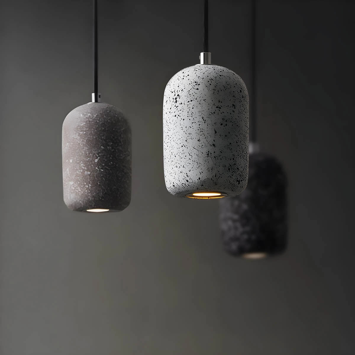 Modern textured concrete pendant light with a sleek rectangular design, featuring a cylindrical ceiling fixture, adding a contemporary touch to kitchen interiors.