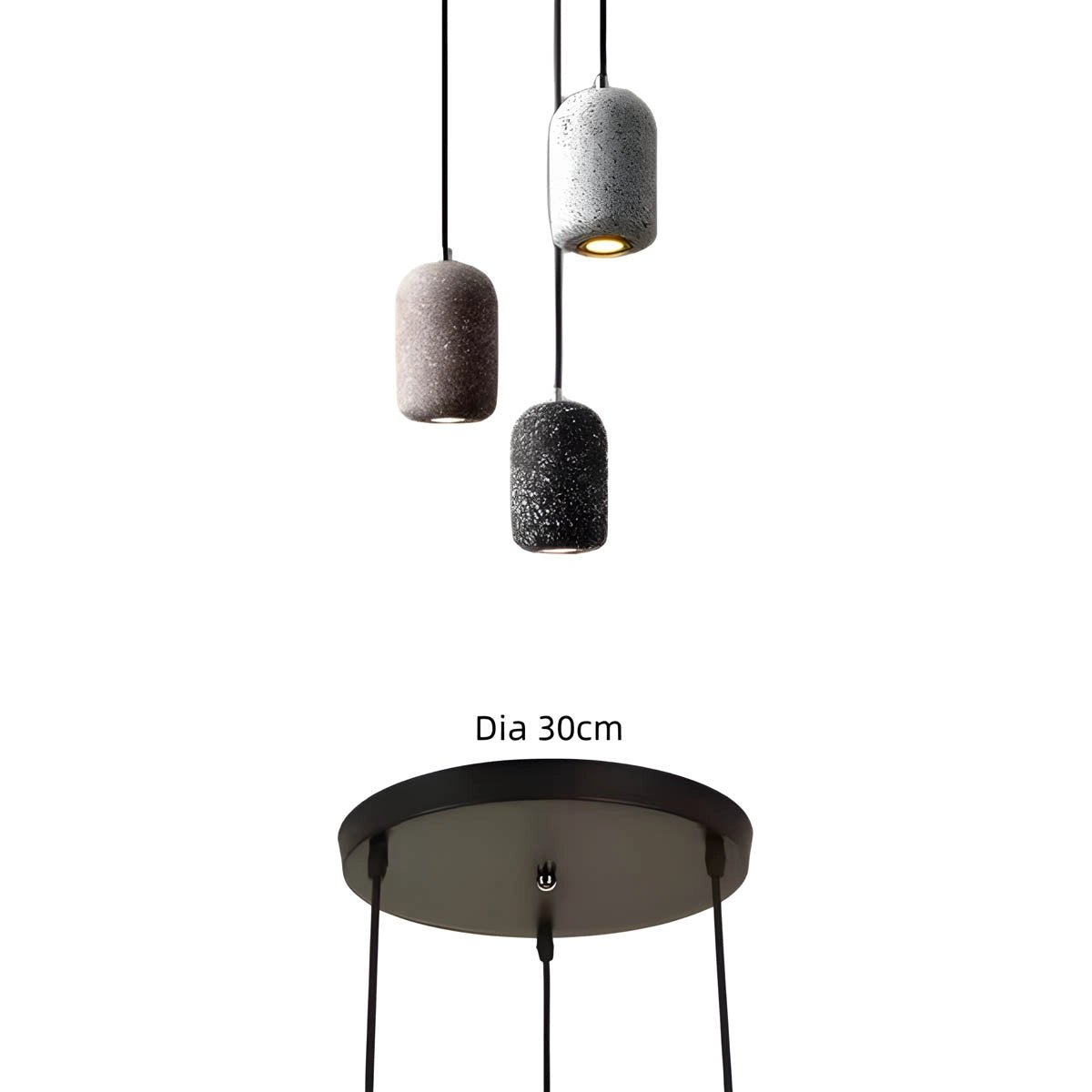 Modern textured concrete pendant lights hanging from the ceiling, illuminating a sleek kitchen design with a contemporary aesthetic.