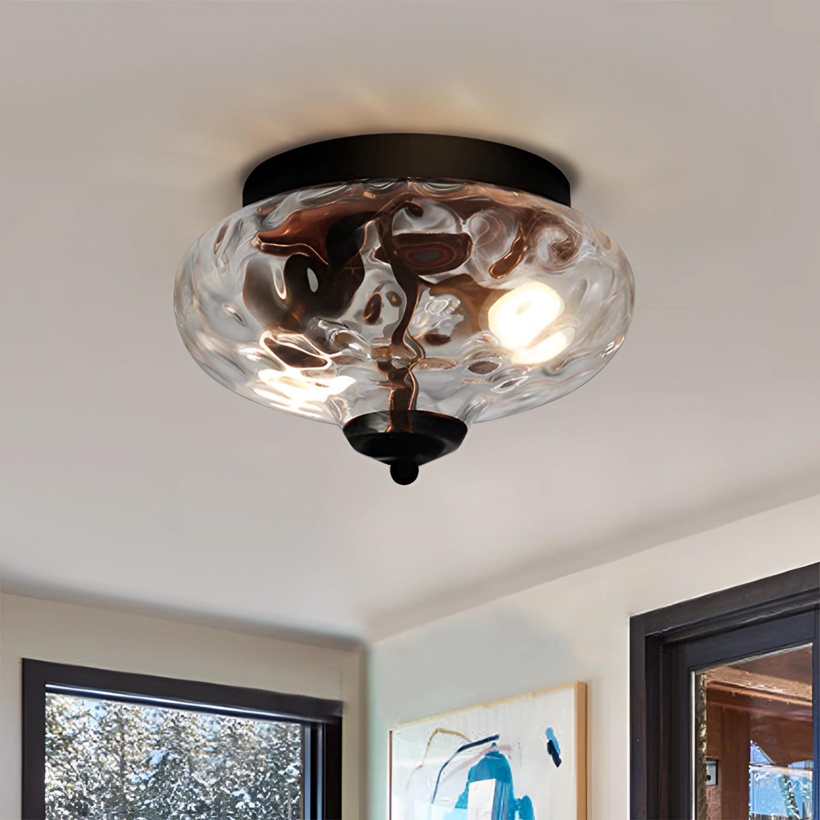 Modern textured glass ceiling light with a clear swirl pattern fixture, elegantly illuminating the interior space. The light is mounted on the ceiling, contributing to sophisticated architectural design.