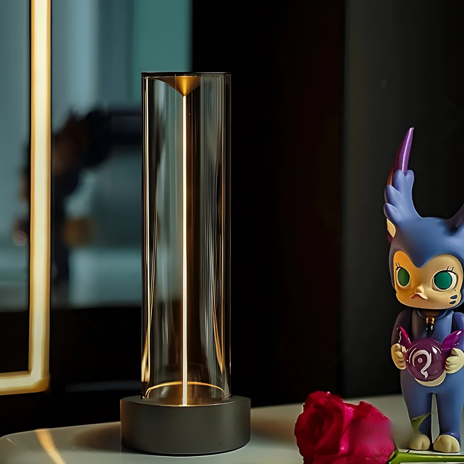 A modern touch LED lamp with a sleek, cylindrical design, featuring a dimmable light. The lamp emits a purple and magenta glow, resembling the petal-like elegance of a rose, suitable for both indoor and outdoor use.