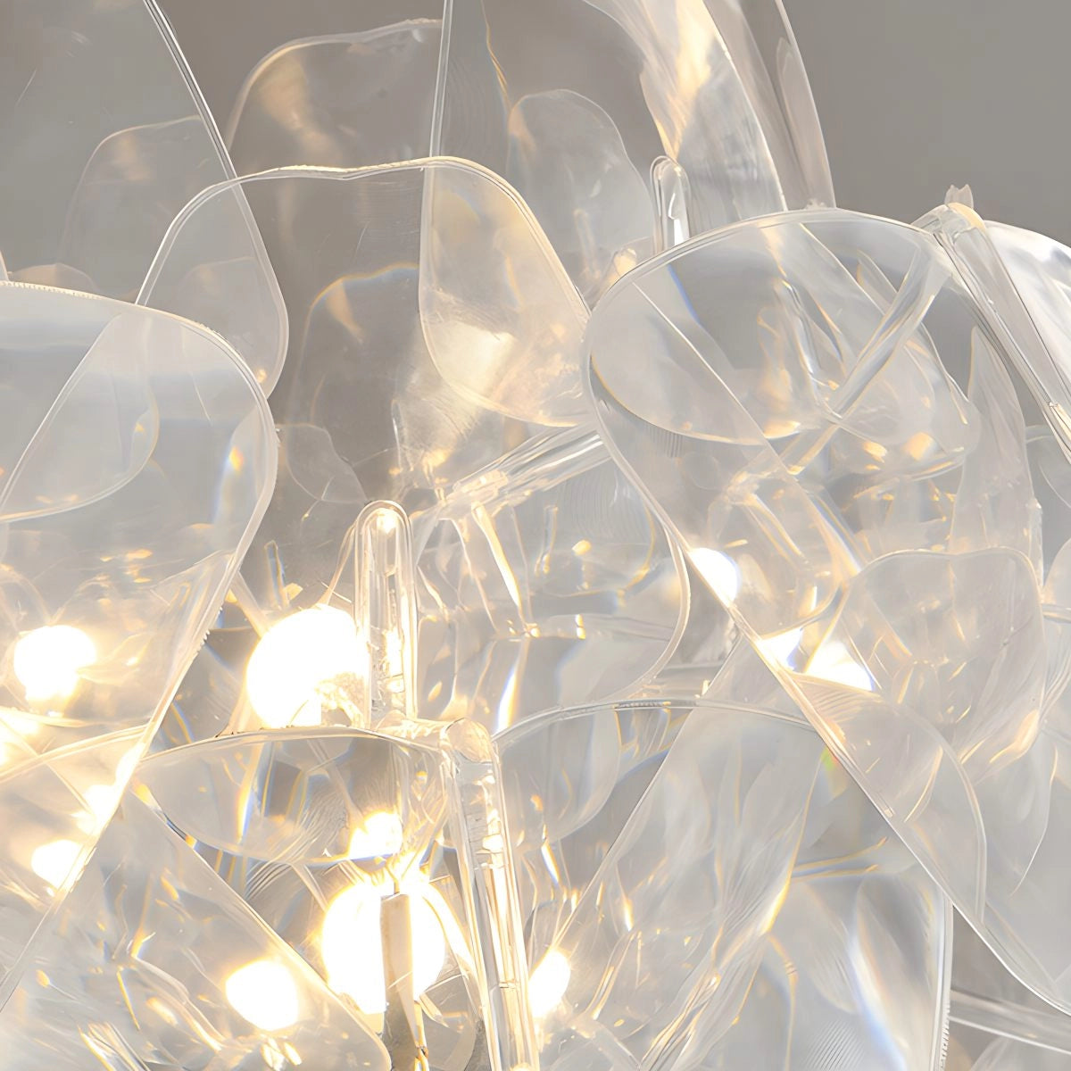Modern Tri-Leg Floor Lamp with Petal Design featuring a clear acrylic globe and metal frame, displayed in a well-lit room.