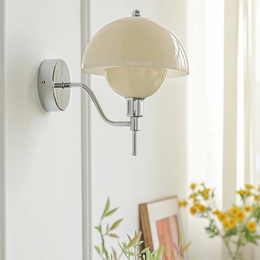 Modern wall lamp with a sleek white globe design, mounted on a wooden base, illuminating a stylish interior space with a touch of elegance.