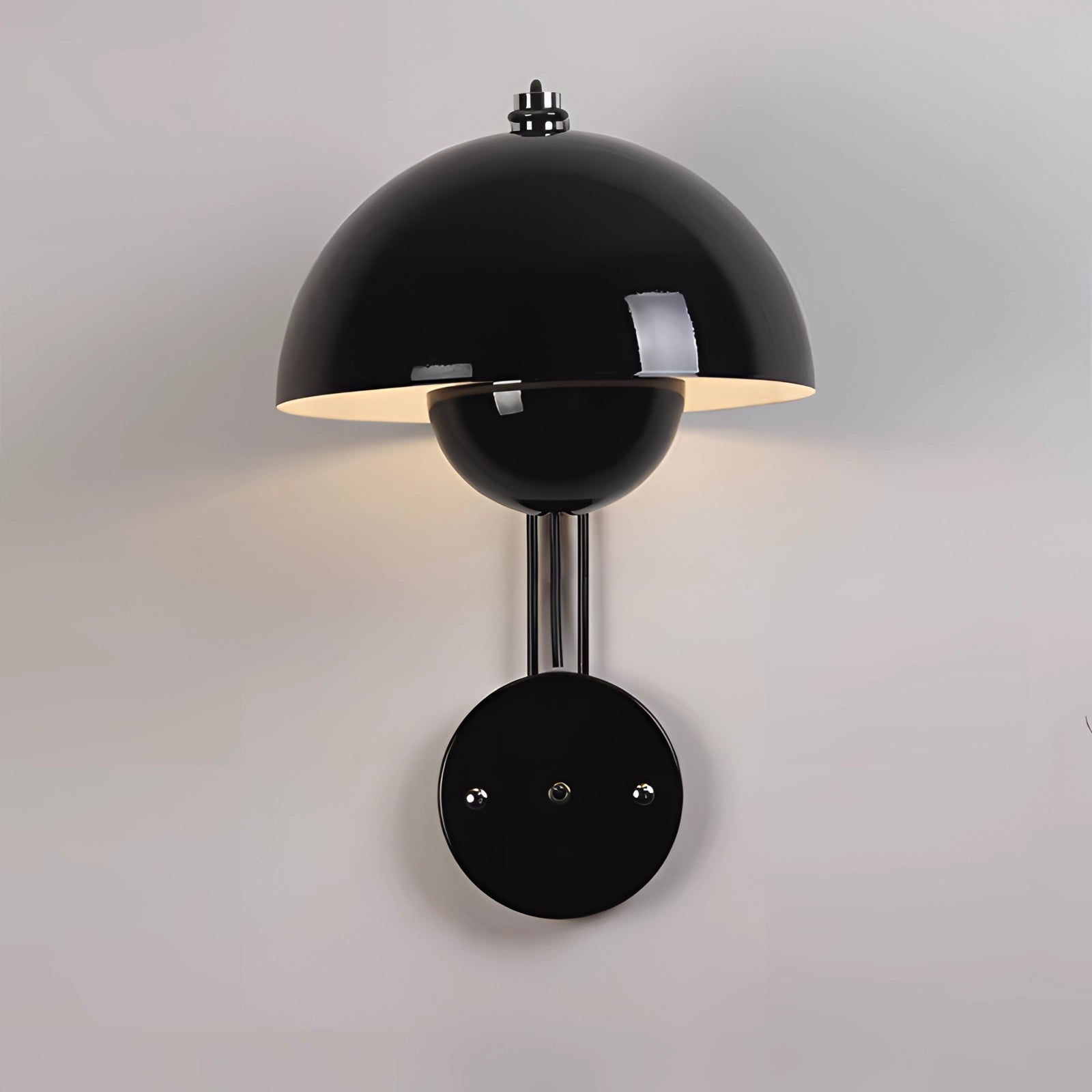 Modern white dome wall lamp in black variant, featuring a minimalist design with a circular lampshade and a sleek silhouette, suitable for contemporary interiors.