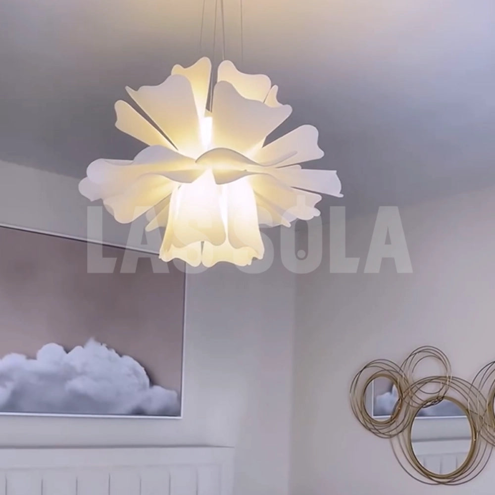 Modern white floral pendant light with a blossom design, featuring a creative and symmetrical pattern, hanging from a ceiling.
