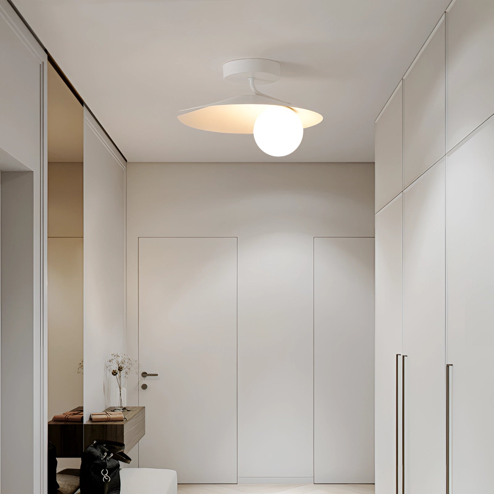 Modern white flush mount ceiling light with a minimalist matte finish, featuring a sleek circular design in a contemporary interior setting.