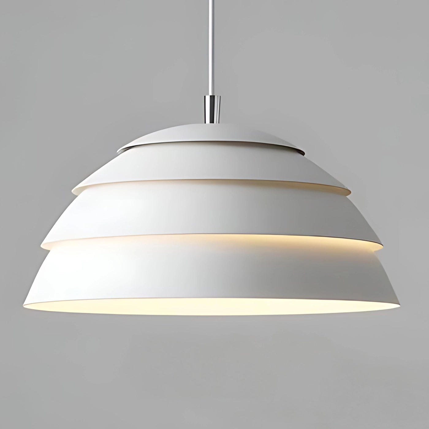 Modern white layered pendant light fixture with a minimalist design, featuring a symmetrical metal lampshade suspended from the ceiling, suitable for indoor use and enhancing contemporary interior spaces.