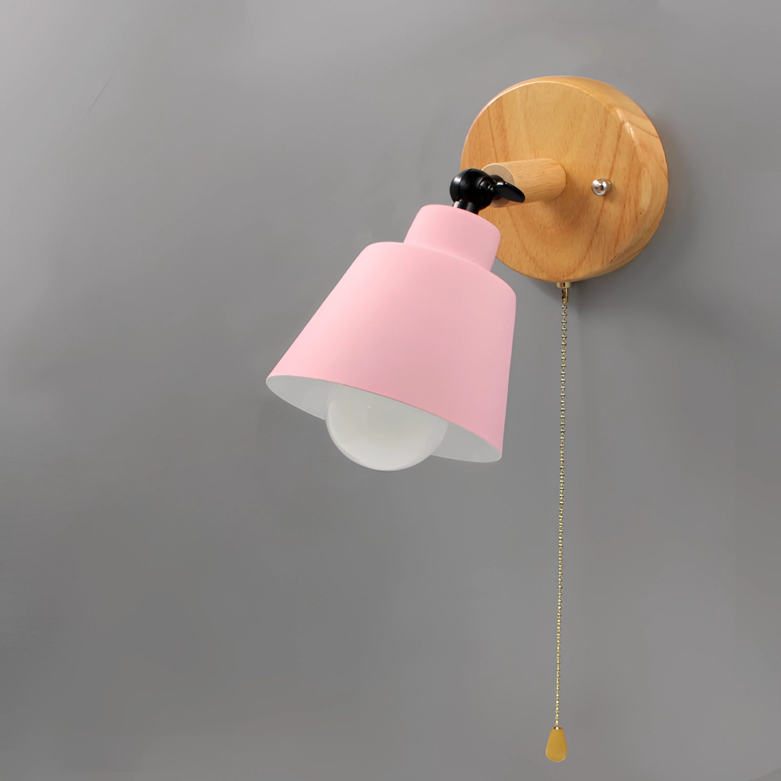 A modern yellow wall lamp with a Scandinavian wooden base and adjustable sconce, shown in a light pink variant.