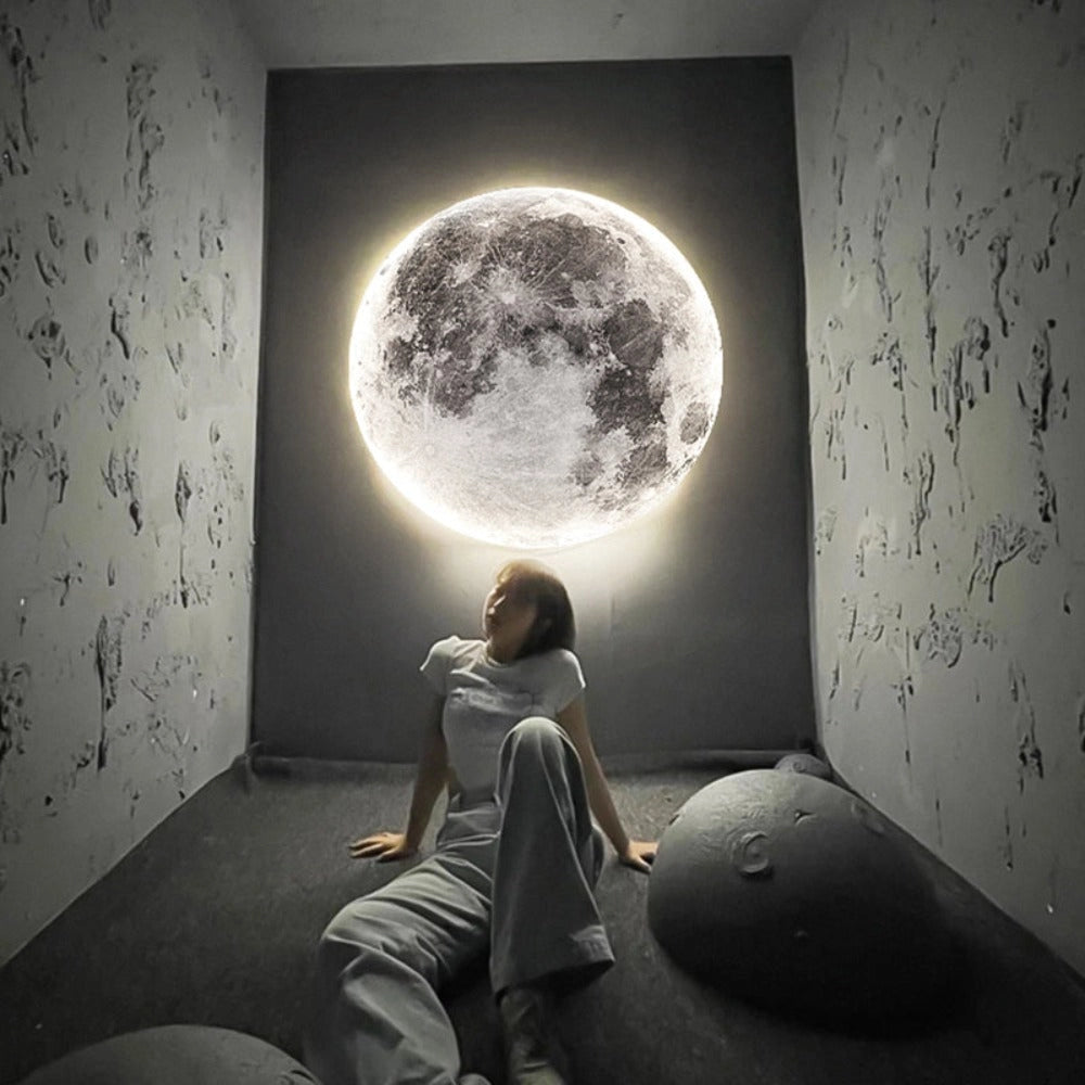 Elegant Moon Ceiling Light fixture in a modern elevator setting, showcasing a sleek black and grey design with cool white LED illumination, enhancing the atmosphere with contemporary art-inspired aesthetics.