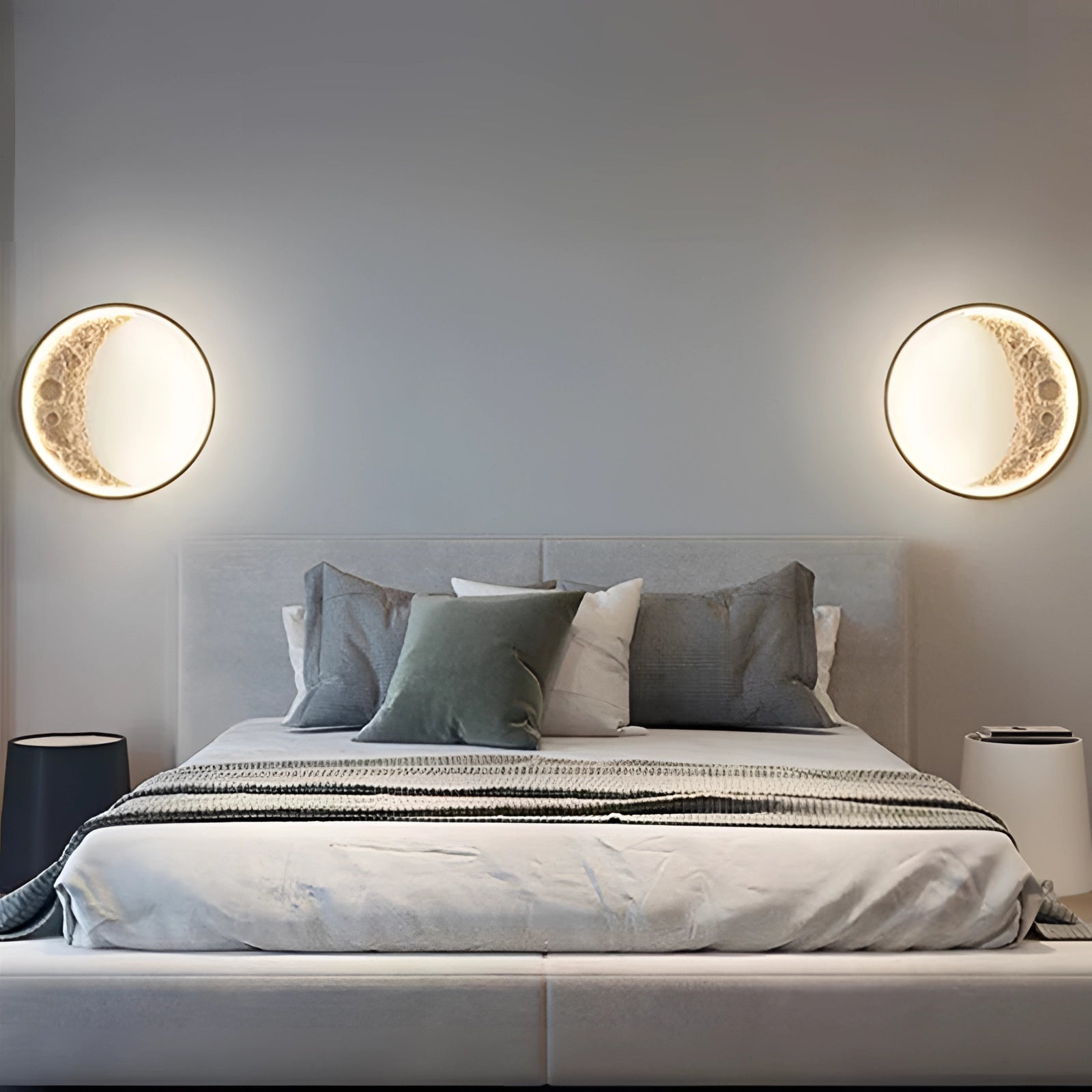 Moon Phase Wall Lights in a wooden frame, providing ambient lighting with celestial crescent and lunar designs. The lighting fixture is mounted on a wall, reflecting on a mirror and enhancing the comfort and decor of the room.