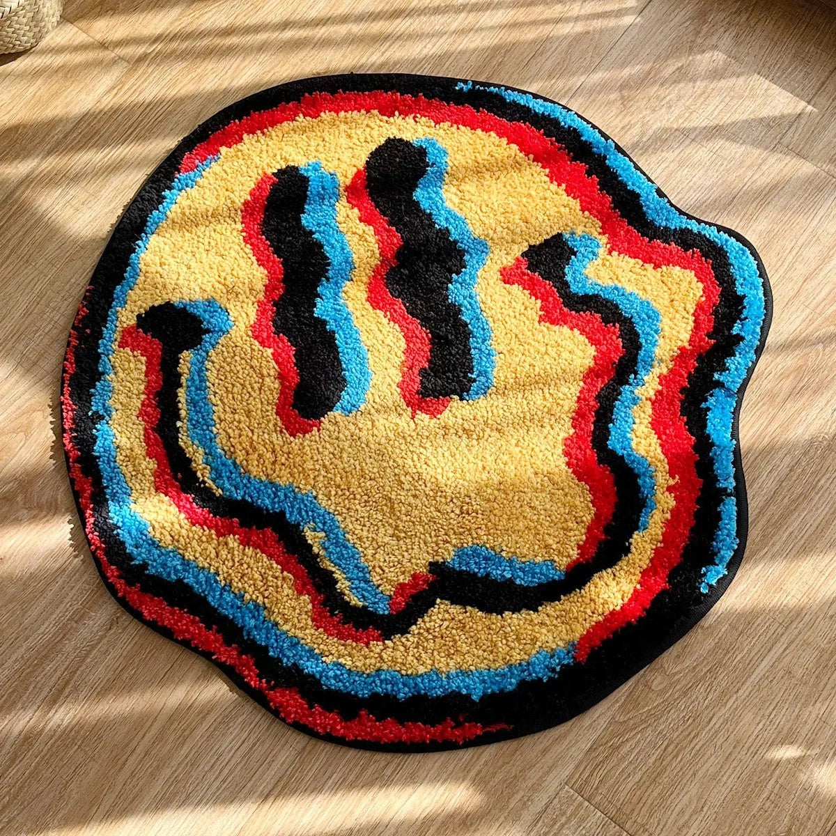 A multicolor high-pile wool rug with a luxurious soft texture, featuring a decorative pattern of circles and rectangles. The rug measures 90 x 90 cm and includes vibrant electric blue accents.