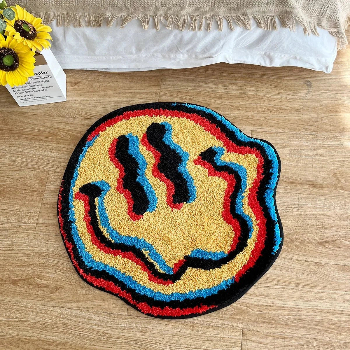 A multicolor high-pile wool rug featuring an intricate pattern with a blend of vibrant colors, including electric blue, displayed on a wooden floor. The rug has a rectangular shape and offers a soft, luxurious texture suitable for decorative purposes.