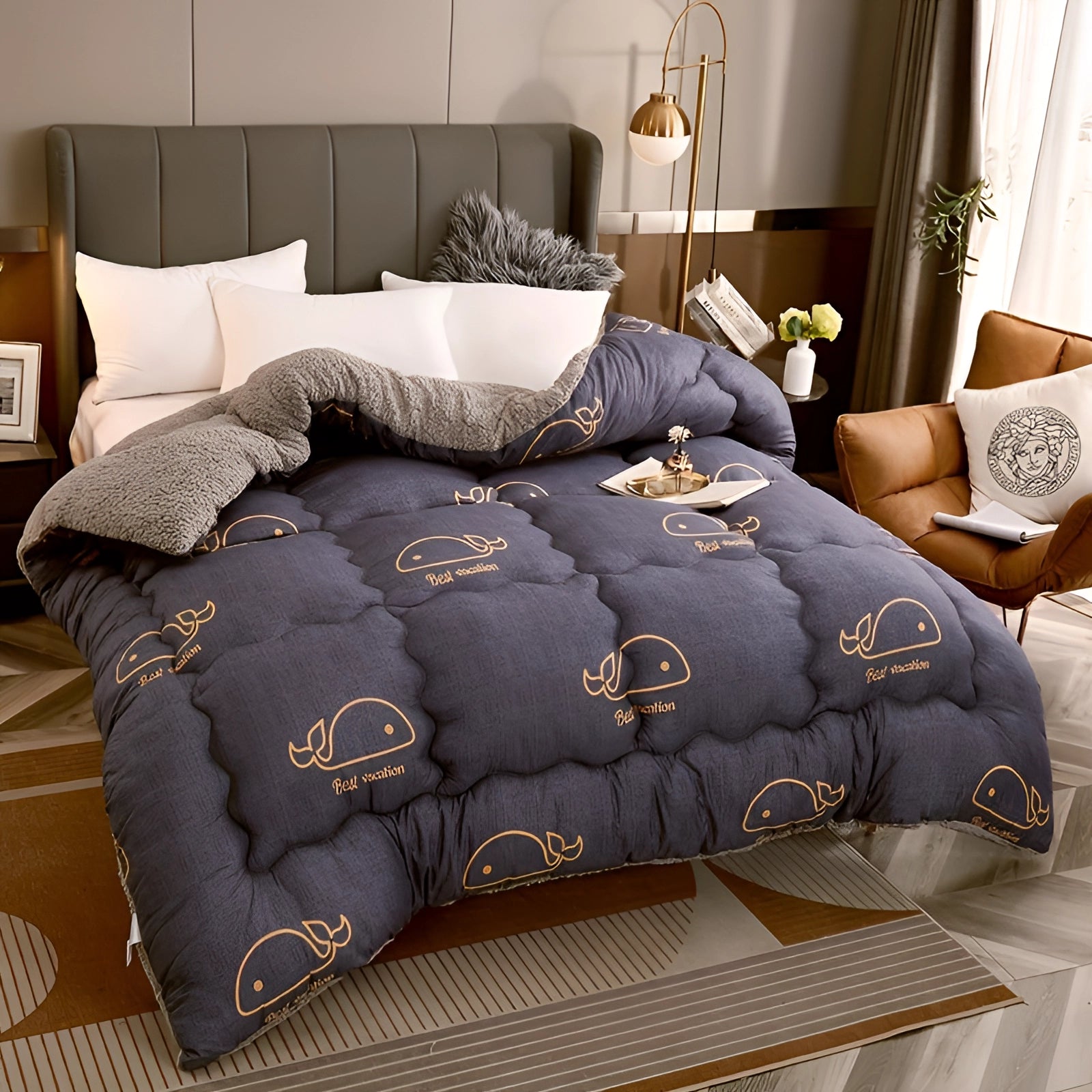 Navy blue star pattern comforter on a bed, surrounded by plush bedding and stylish decor, featuring a wooden bed frame and cozy atmosphere.