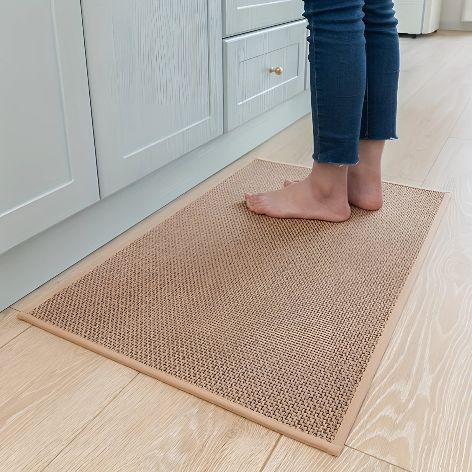 Beige rectangular sisal kitchen mat on a wooden floor, measuring 50 x 80 cm.