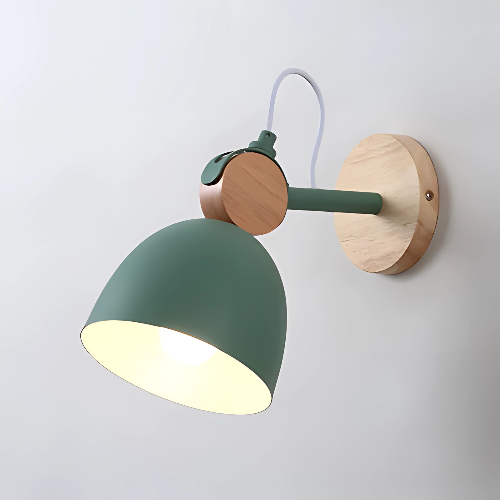 Nordic LED wall lamp in a sleek white Scandinavian design with adjustable features, showcasing a smooth green color variant. The lamp incorporates elements of wood and metal, with a circular shape reminiscent of a wheel or propeller, suitable for both ceiling and wall installation.