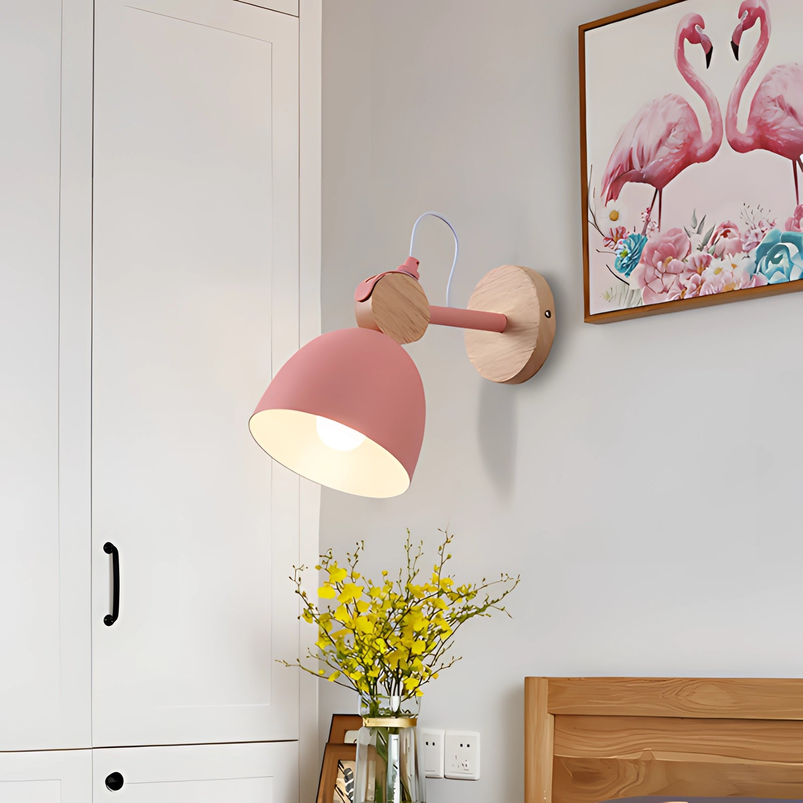 Sleek white Nordic LED wall lamp with adjustable arm, featuring a Scandinavian design, mounted on a wall above a wooden shelf with decorative elements like a picture frame, vase, and plant, showcasing modern interior decor.